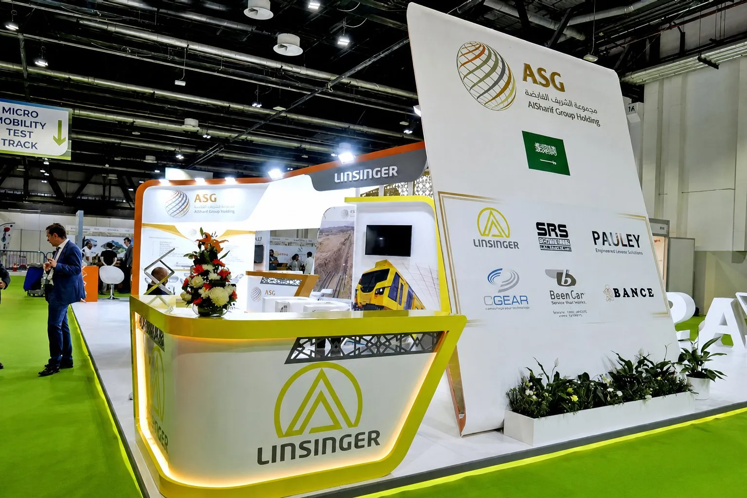 Reception counter of the stand with partner brand logos behind