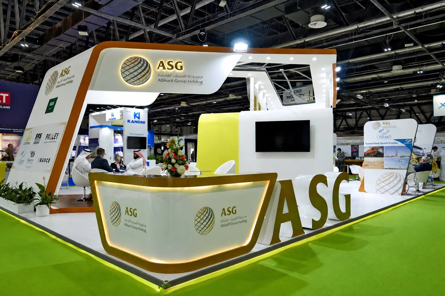 AlSharif Group Holding exhibition stand with curved counters and partner brand logos